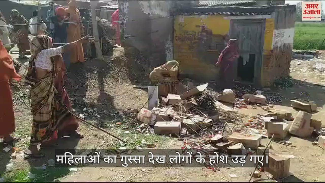 VIDEO : हाथ में लठ्ठ और चेहरे पर घूंघट लेकर शराब की ठेके पर पहुंचीं महिलाओं ने मचाया बवाल