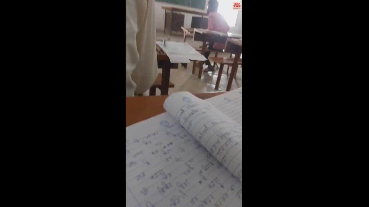 VIDEO : Video goes viral students taking exam with mobile phone in Kashi vidyapeeth four cheaters caught