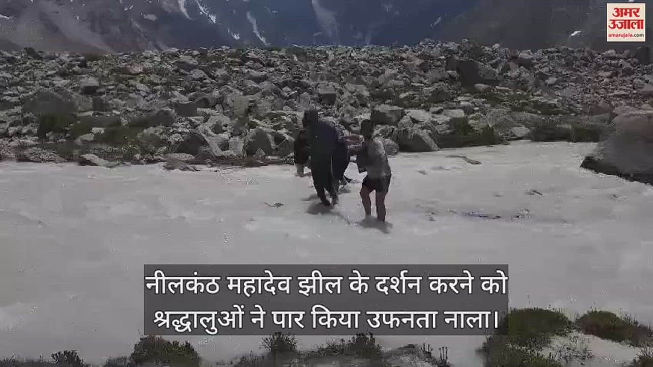 VIDEO : Devotees took risks by crossing a swollen drain to visit Neelkanth Mahadev lake