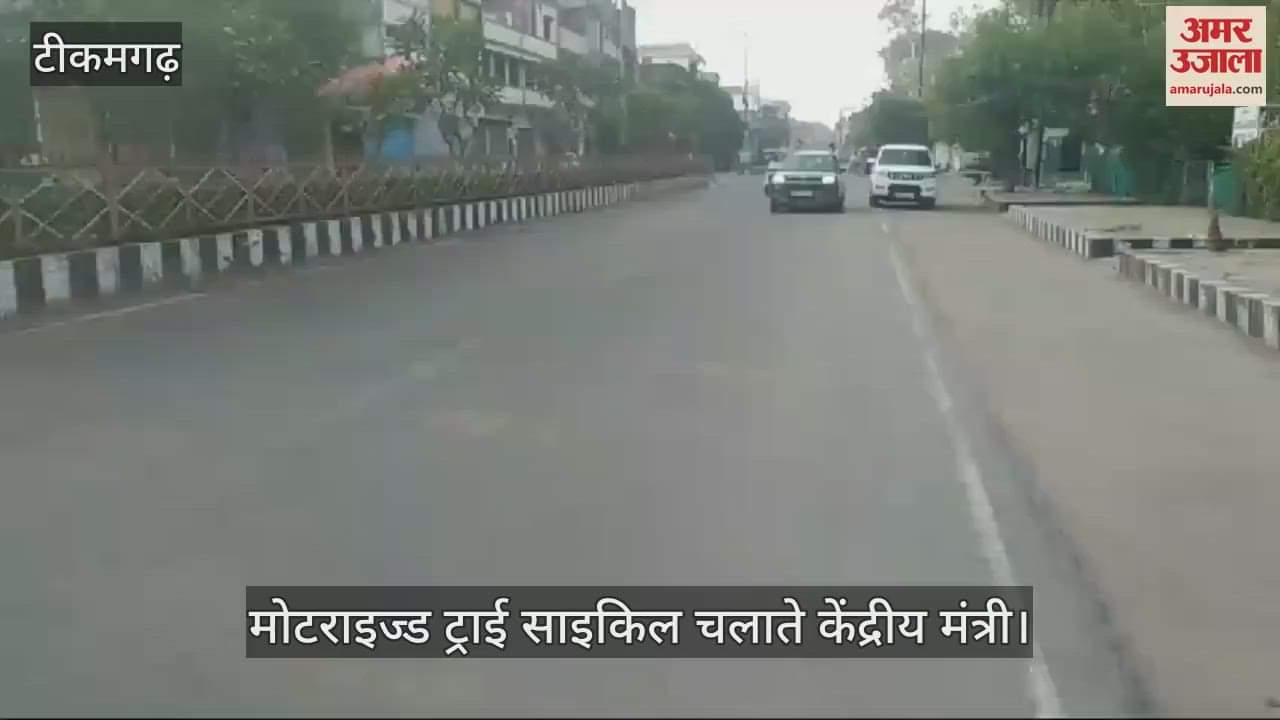 The minister was seen riding a motorized tricycle