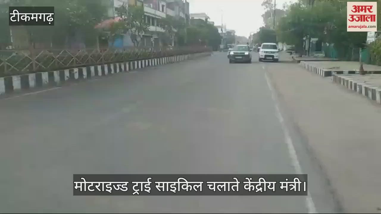 The minister was seen riding a motorized tricycle