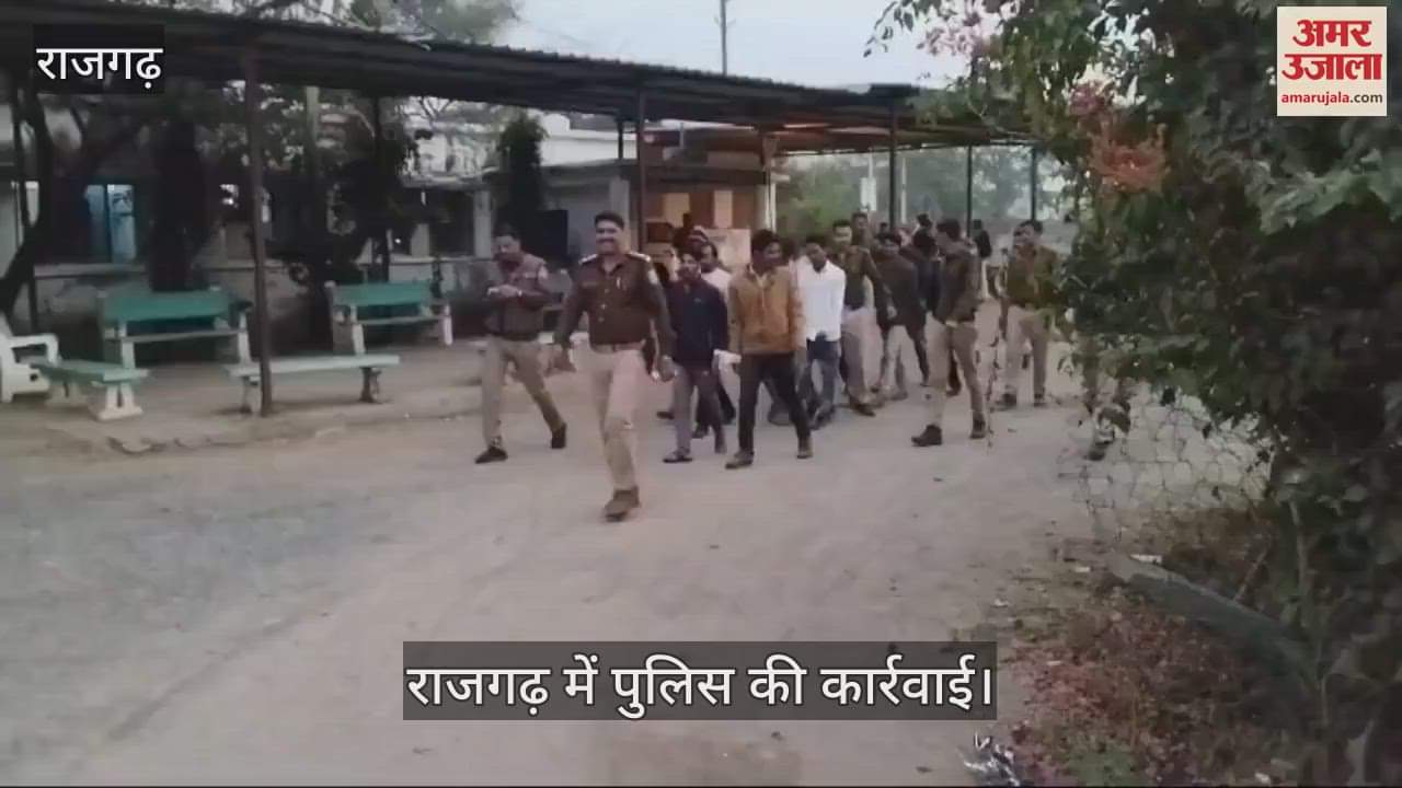 Police taking out procession of accused involved in illegal activities in Rajgarh