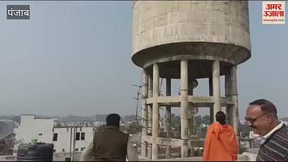 VIDEO : condition of Improvement Trust's MIG flats is bad, Shiv Sena leader climbed on water tank in pathankot VIDEO : condition of Improvement Trust's MIG flats is bad, Shiv Sena leader climbed on water tank in pathankot