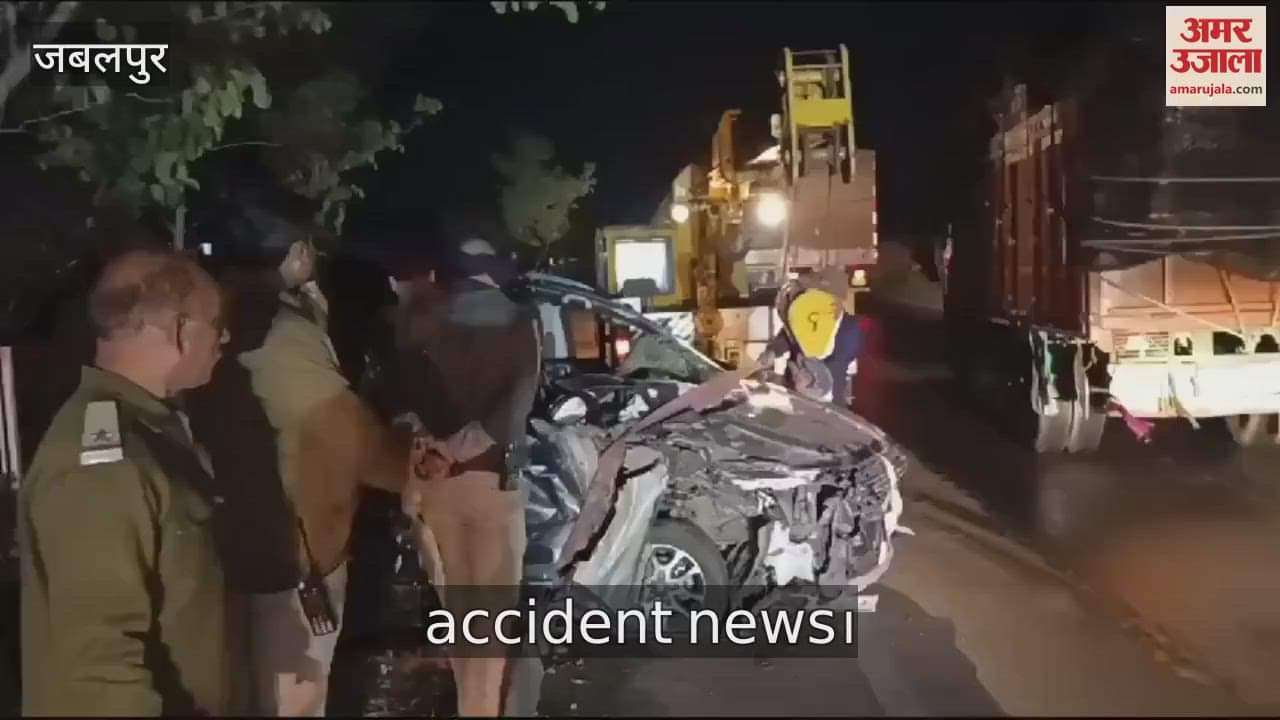 Car collides with parked truck, two dead