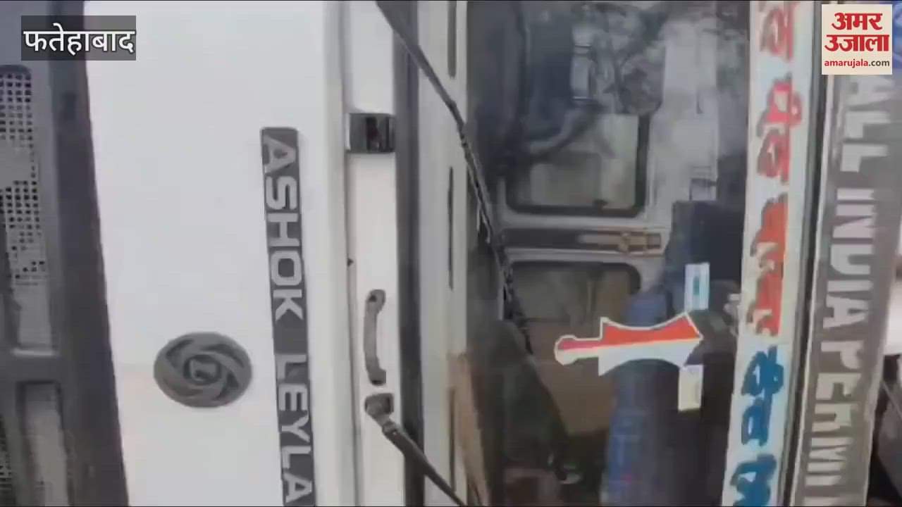 VIDEO : truck overturned near canal in Tohana, people were pulled out after breaking glass