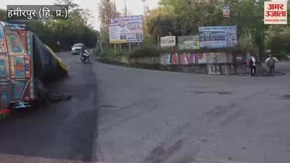 Hamirpur A truck loaded with cement overturned on the road in Bhota on NH 103 after going out of control