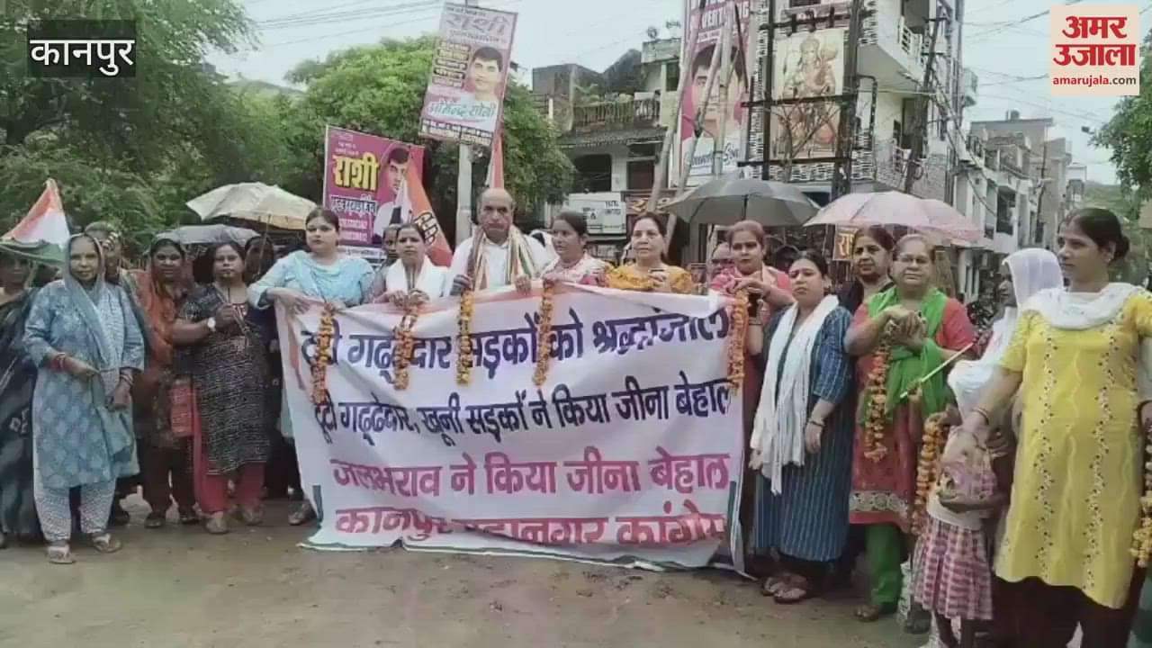 Congress protested by offering garlands and incense sticks to broken roads