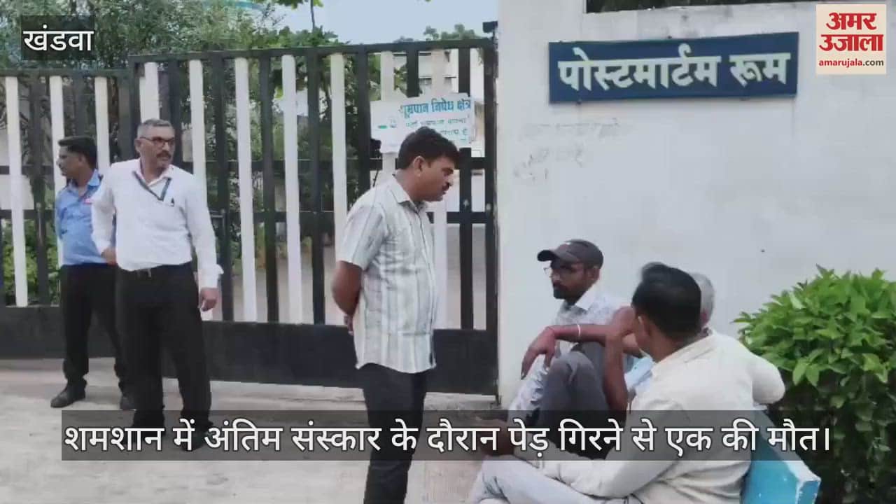 One died and one was injured when a tree fell on crematorium during a funeral