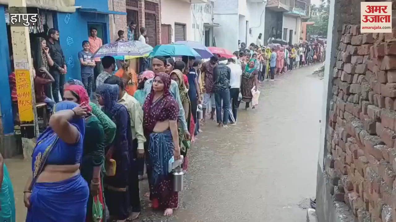 Devotees standing for Jalabhishek in the rain at Sabli Mahadev temple in Hapur