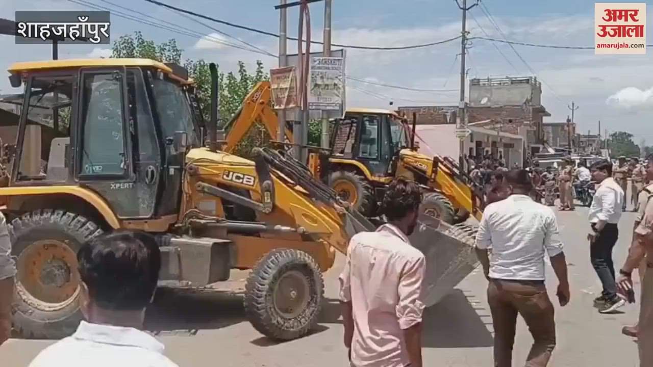 houses and shops built on pond land were demolished with a bulldozer in shahjahanpur