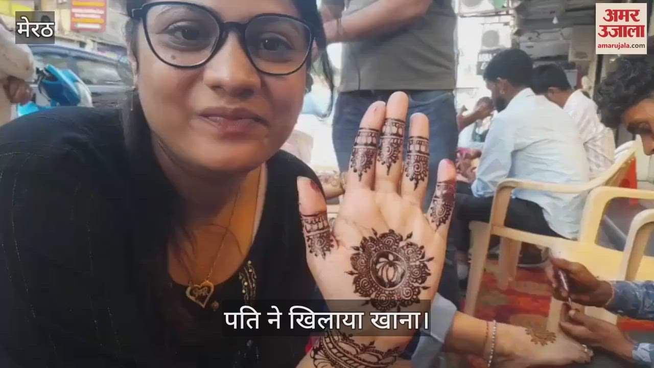 Teej special...Mehndi on both hands, caring husband feeding her