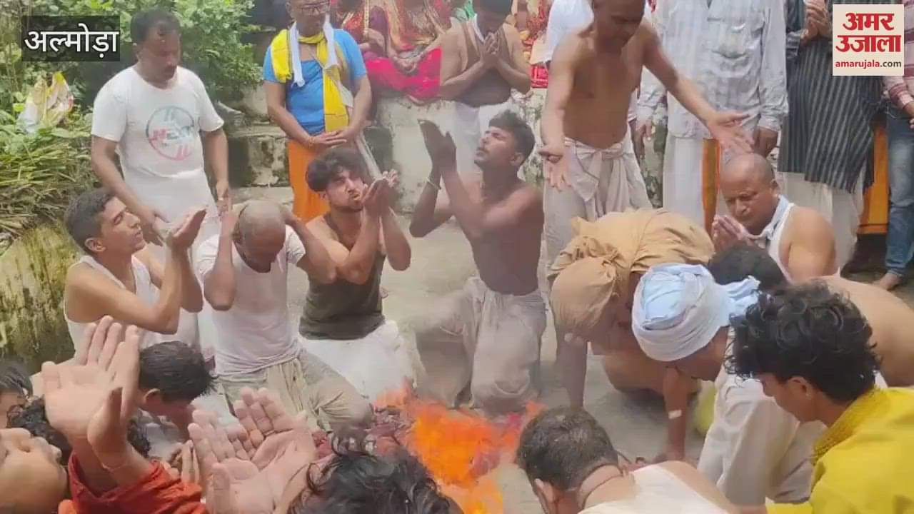 Devotees took holy bath with drums and trumpets in almora
