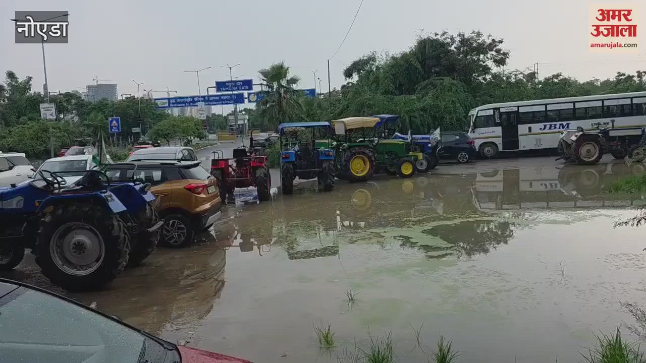 Waterlogging on service road in front of gate of Formula Track