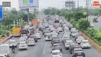 Truck loaded with wheat overturned in heavy rain Noida-Greater Noida Expressway