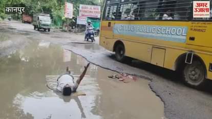 Unique protest against waterlogging in potholes