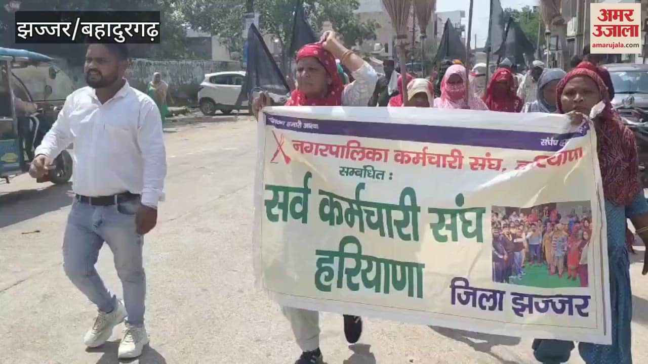 sanitation workers demonstrated by sweeping upside down to demand In Jhajjar