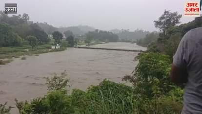 Una Due to heavy rains Garni Khad is in spate water flows over the foot bridge