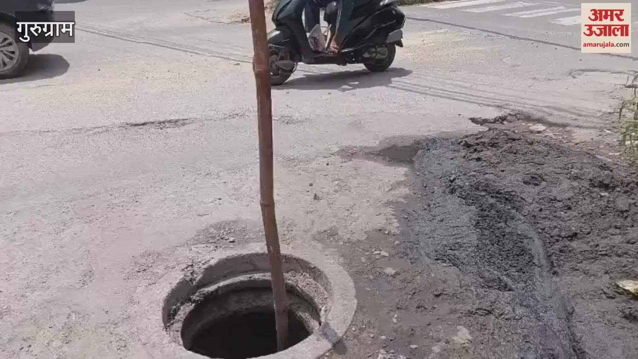 Sewer lid lying open on the road near Sector 15 Road Police Line