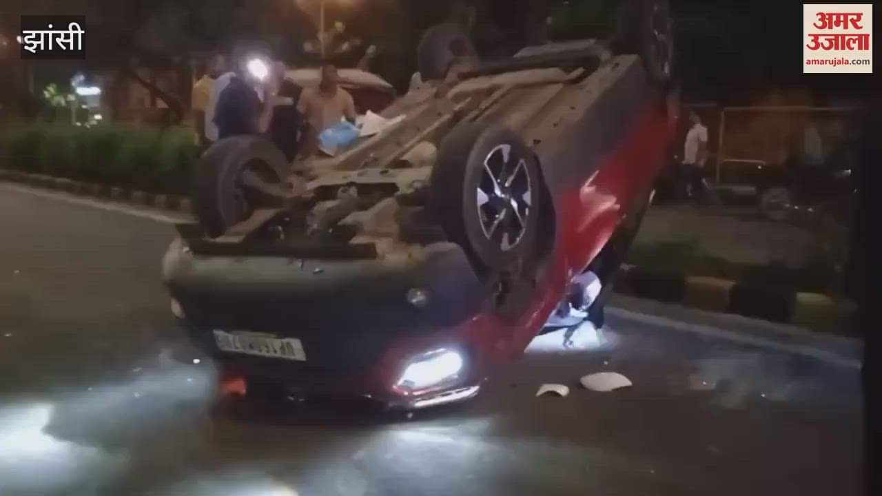 Jhansi: High speed car hits parked Innova car, hits divider and overturns