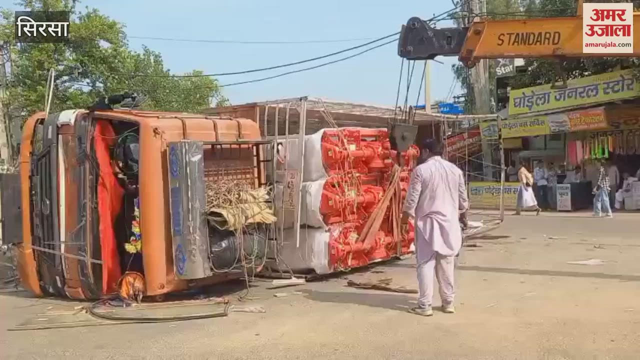 truck overturned due to a tyre burst at Chaudhary Devi Lal Chowk in Nathusari Chowpata in Sirsa, the driver narrowly escaped
