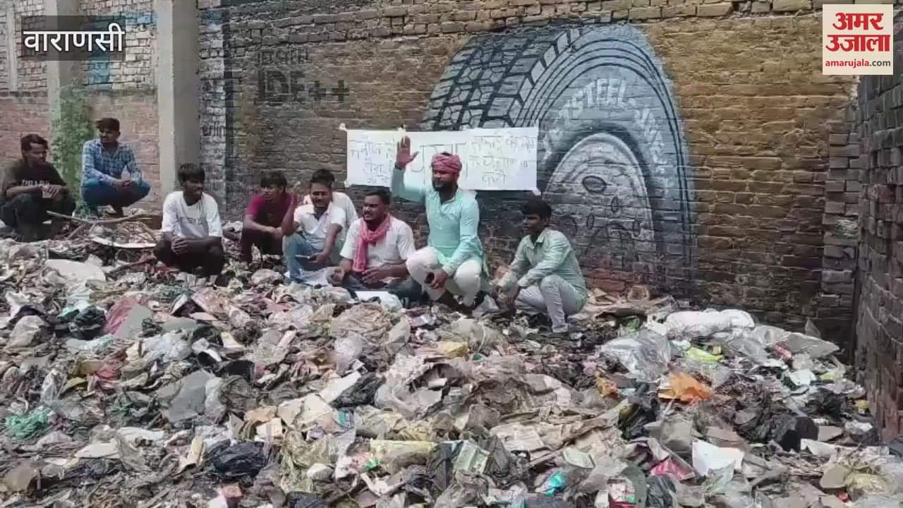 Protested by sitting on pile of garbage officials assured cleaning