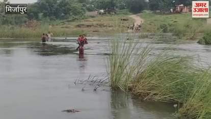 Father taking his kids to school on his shoulders