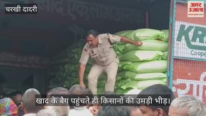 Crowd of farmers gathered as soon as bags of fertilizer arrived