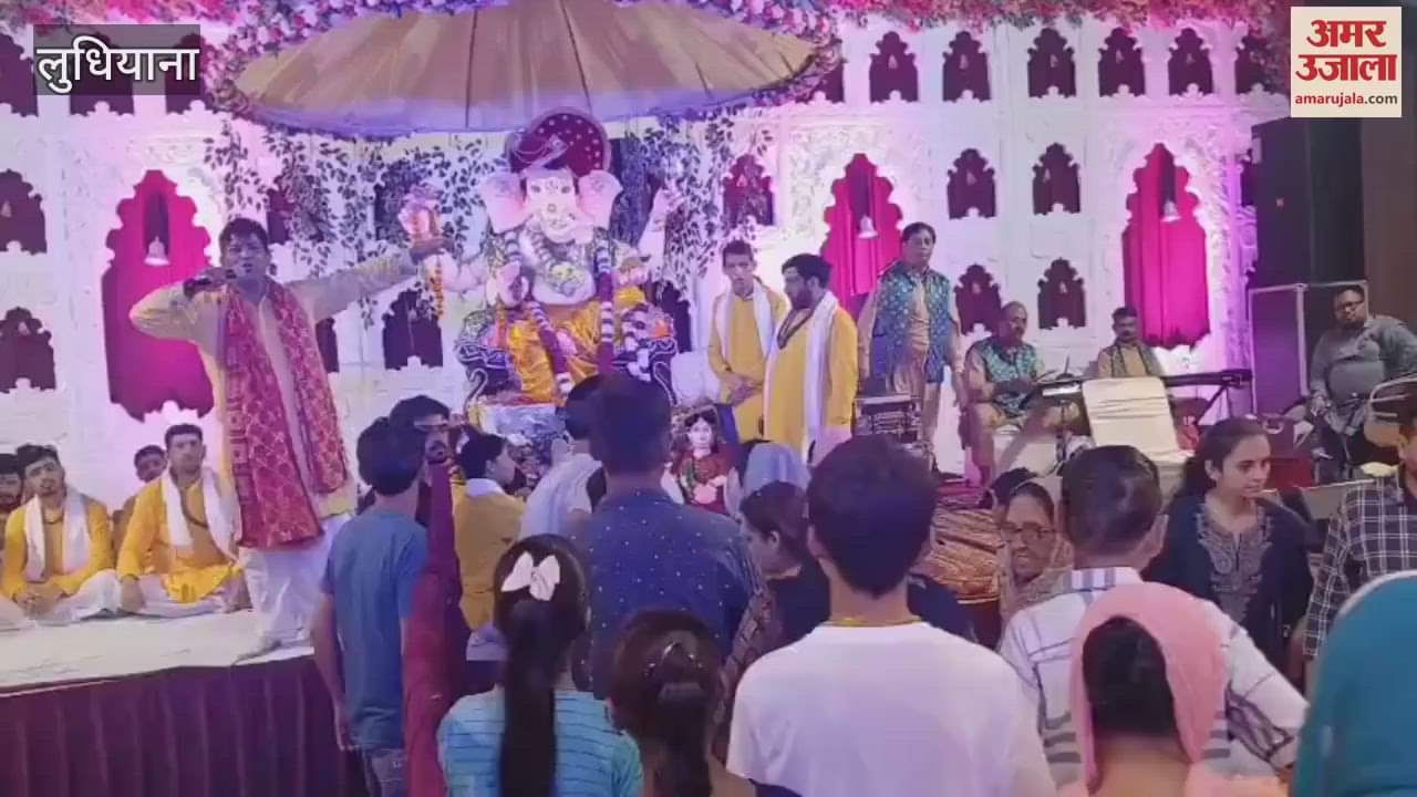 Devotees dance during Ganpati festival in Kitchlu Nagar, Ludhiana