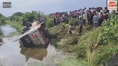 private bus overturned in a water-filled ditch in Badaun