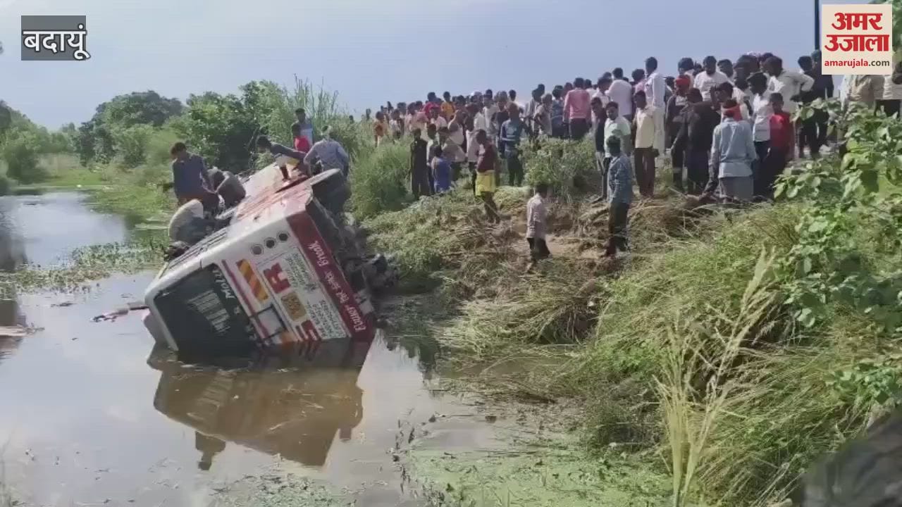 private bus overturned in a water-filled ditch in Badaun