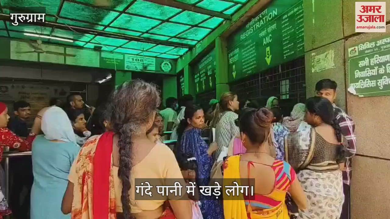 People are forced to stand in dirty water to get medicines at Sector 10 Civil Hospital in Gurugram