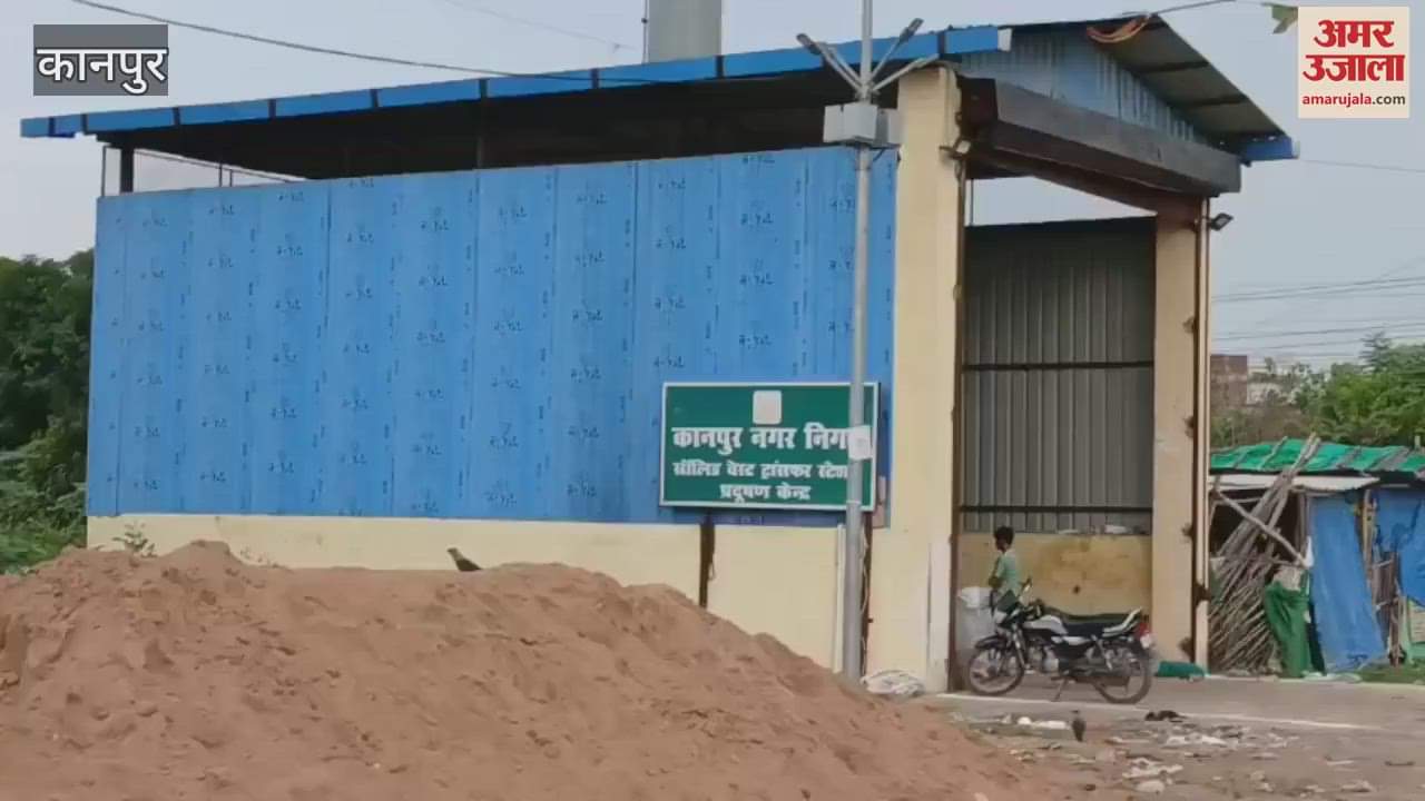 pile of garbage on the road in front of the garbage hous