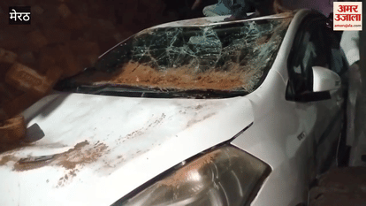 Meerut: A speeding truck filled with bricks overturned on a car, resulting in a jam.