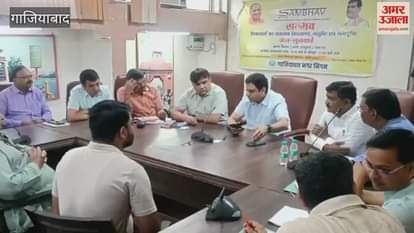 Municipal commissioner conducting hearing during Sambhav