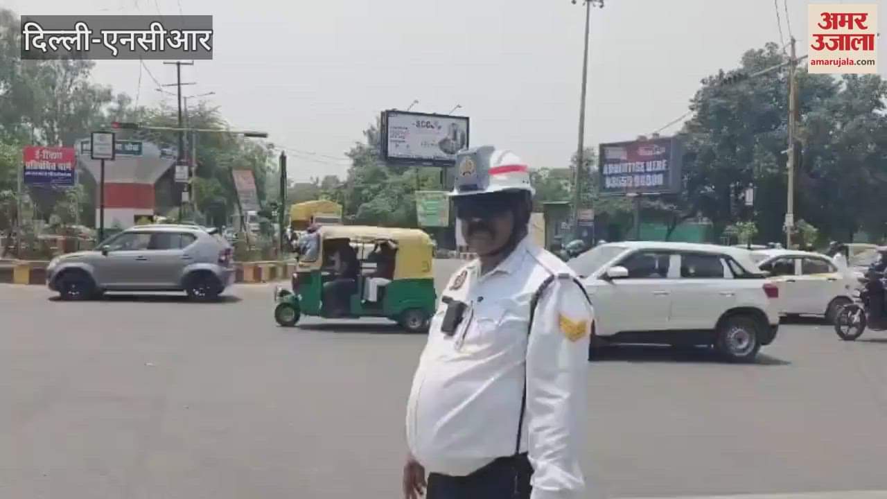 Ghaziabad traffic policeman wearing AC helmet controls traffic in summer