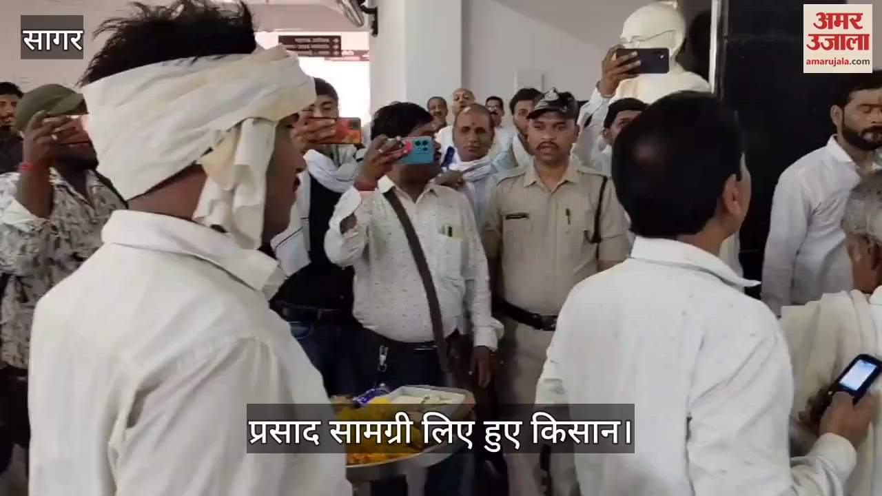demand for resolution of land dispute farmer at collectorate public hearing with garland coconut prasad