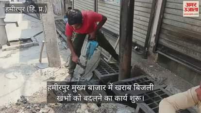 New electricity poles are being installed in place of damaged ones in the main market