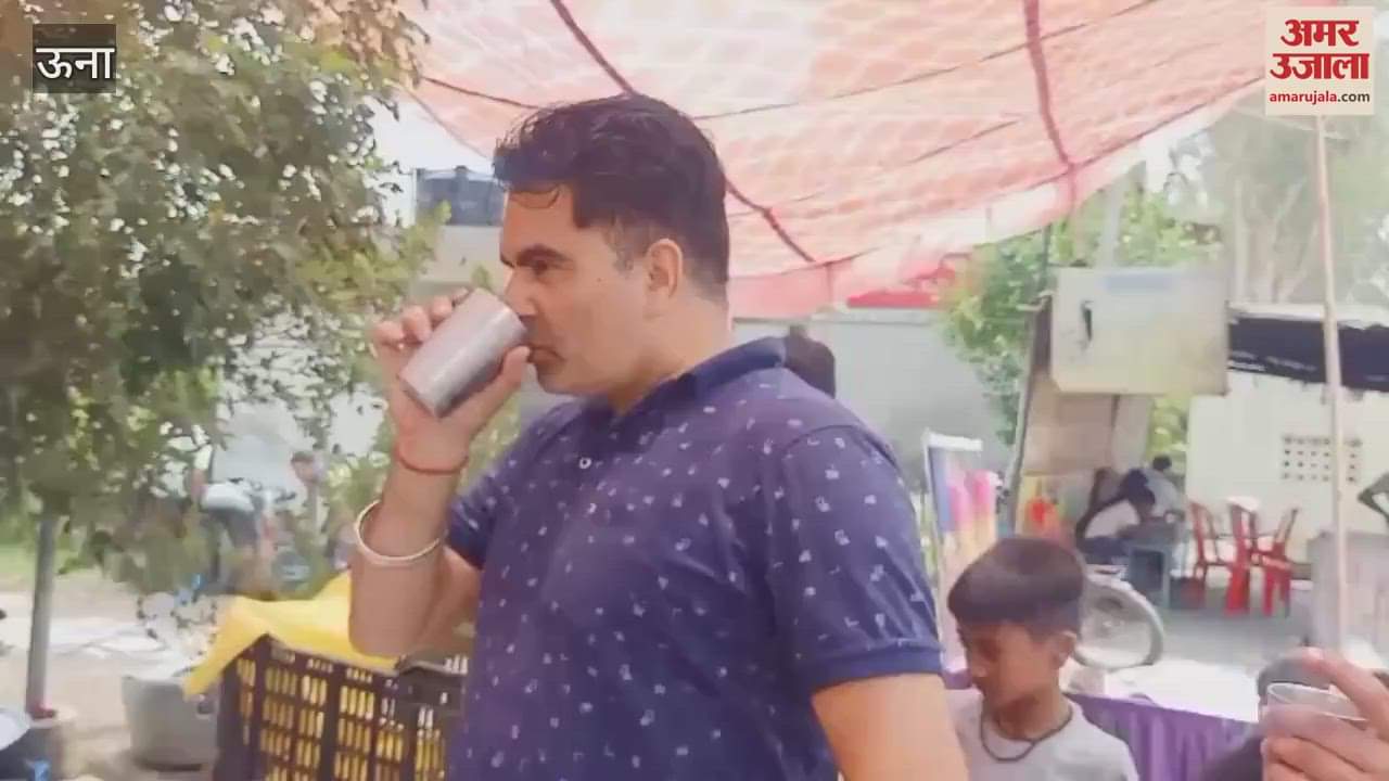 Una In Baduhi local shopkeepers set up a stall of cold water for passersby