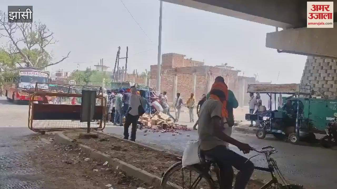 After accident in Jhansi people ran to pick up tetra packs of liquor scattered on the road