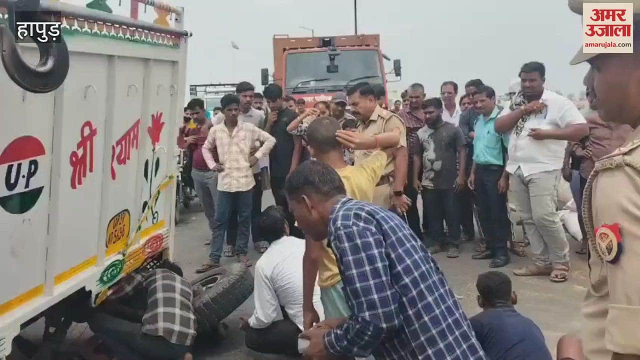 A pickup loaded with wheat sacks overturned due to axle breakage in Hapur