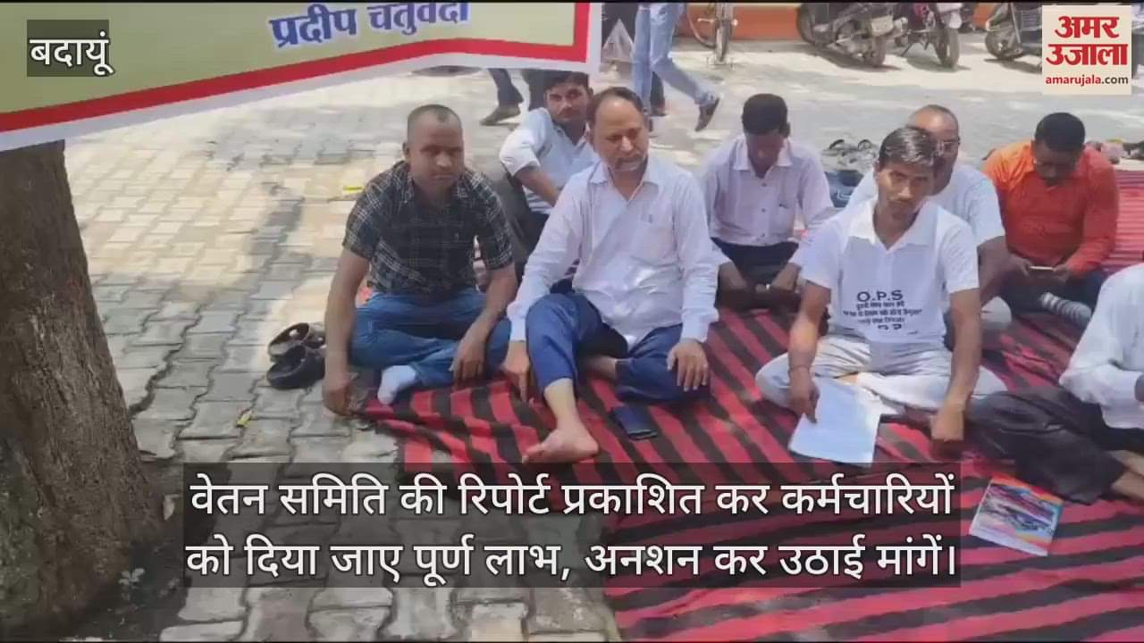 Employees sit on hunger strike in the district hospital premises of Badaun