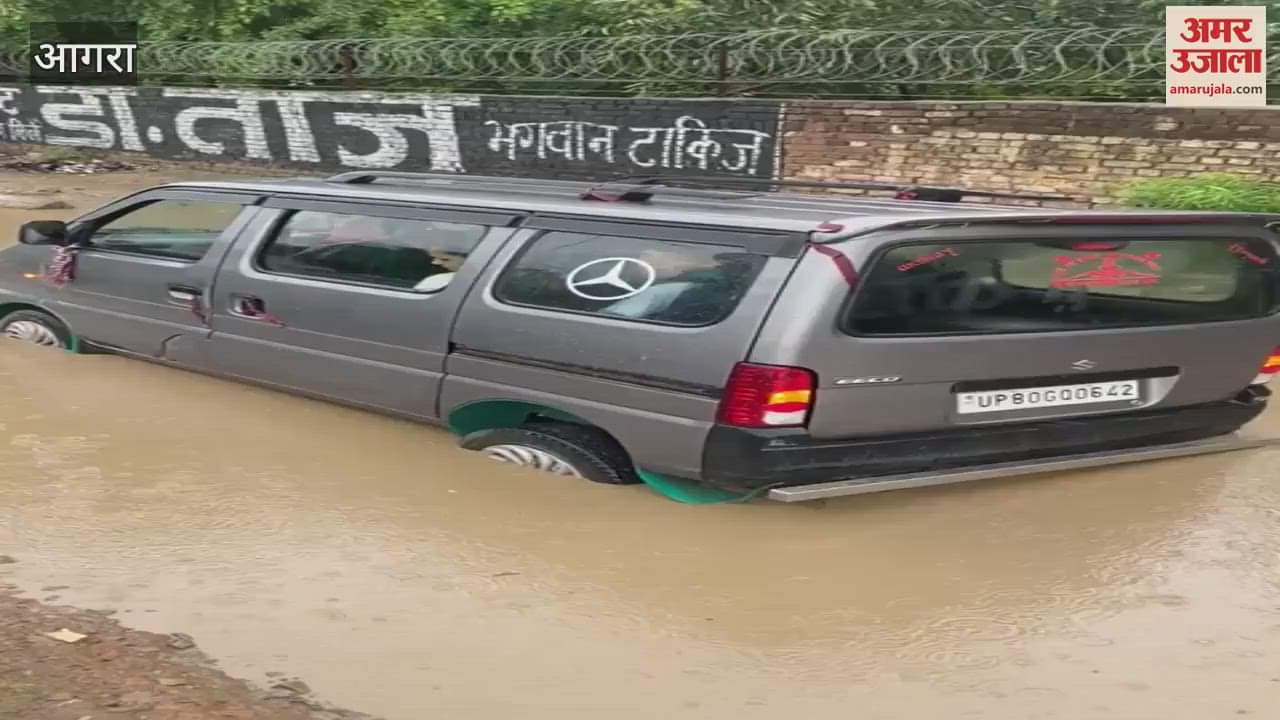 School van stuck in a water-filled pit
