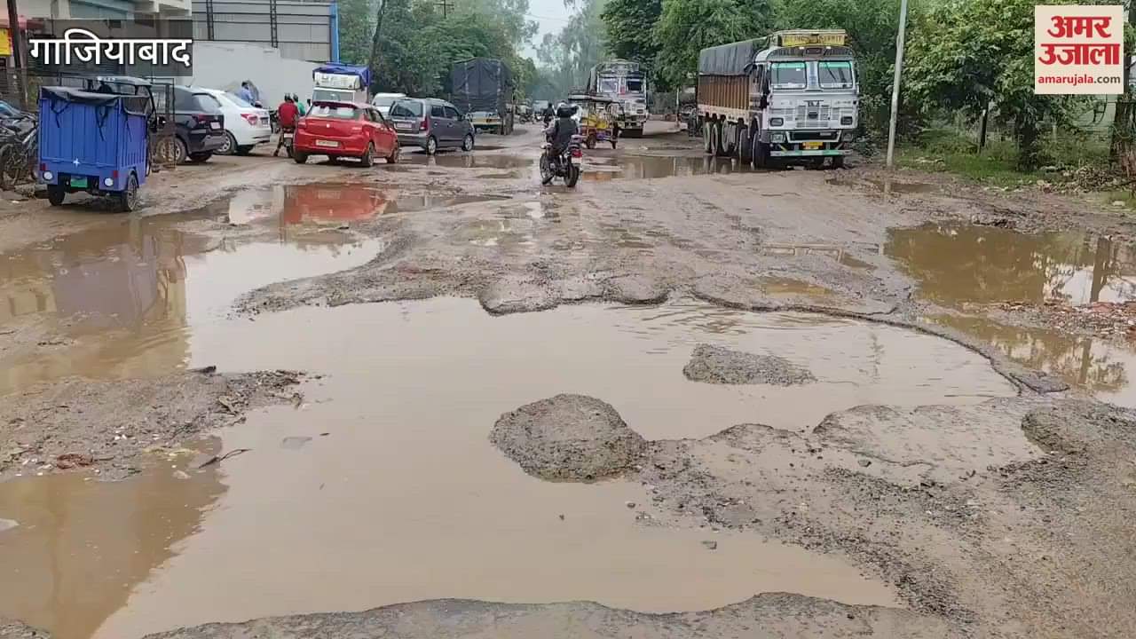 Vehicles passing through waterlogging in Sahibabad