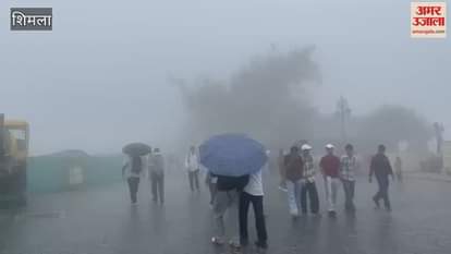 Shimla is covered with clouds fog and light rain showers