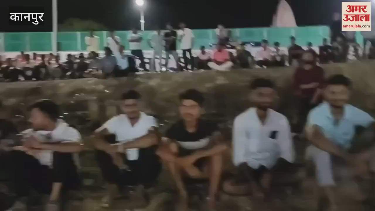 Crowds of spectators gathered for the final match of cricket tournament being held at night in Purvamir