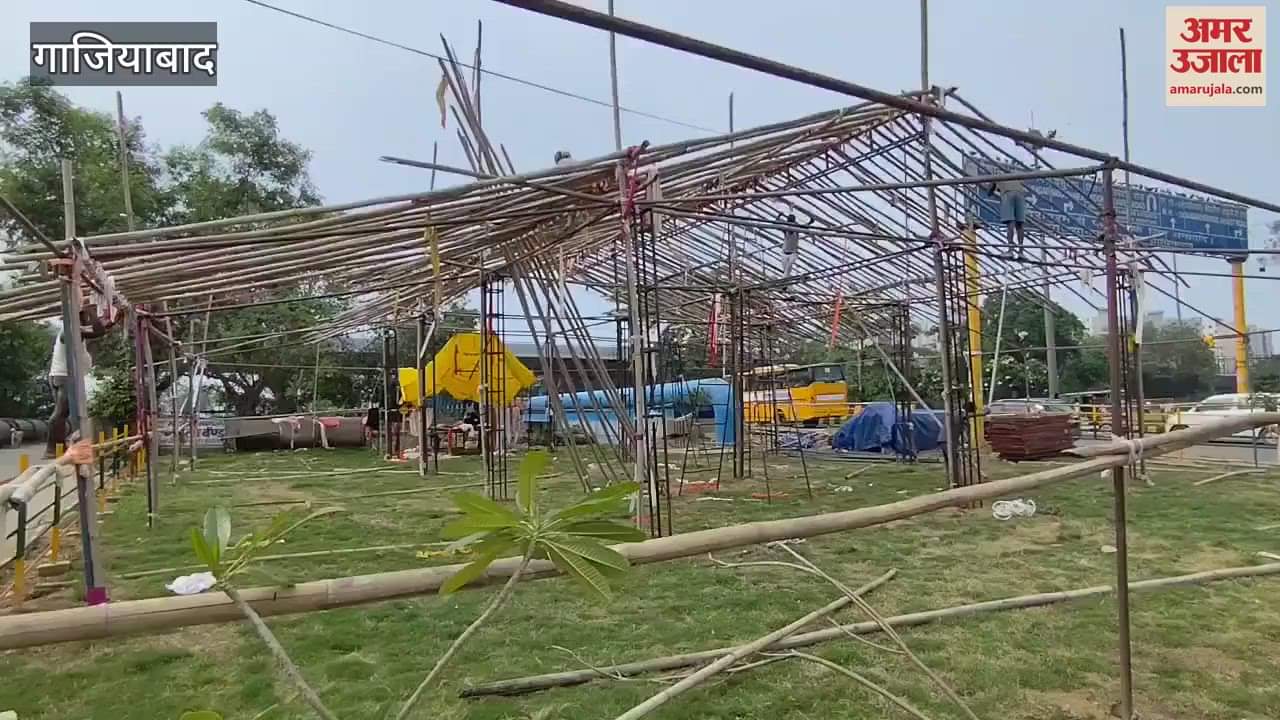 Workers set up Kanwar camp in the green belt near Kanavani bridge in Ghaziabad