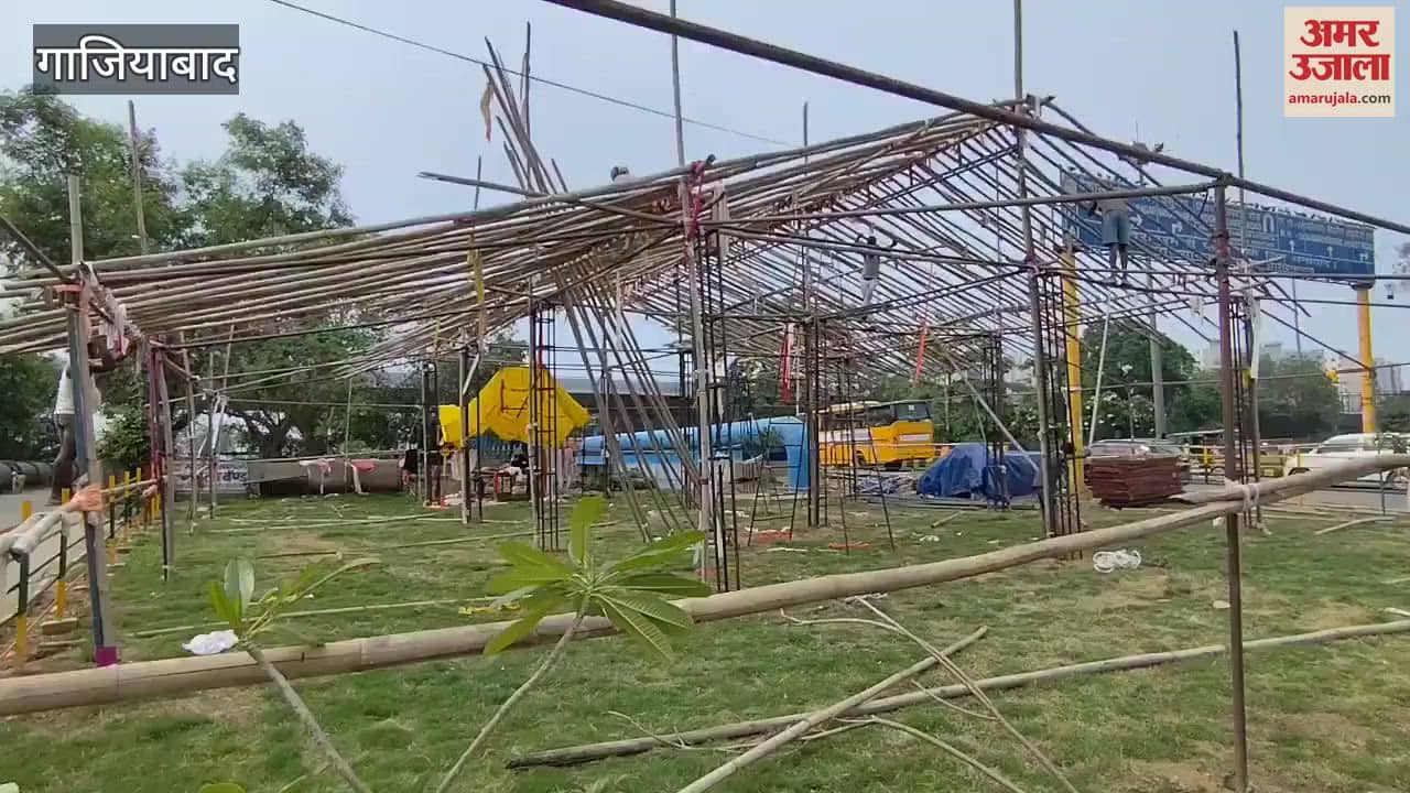 Workers set up Kanwar camp in the green belt near Kanavani bridge in Ghaziabad
