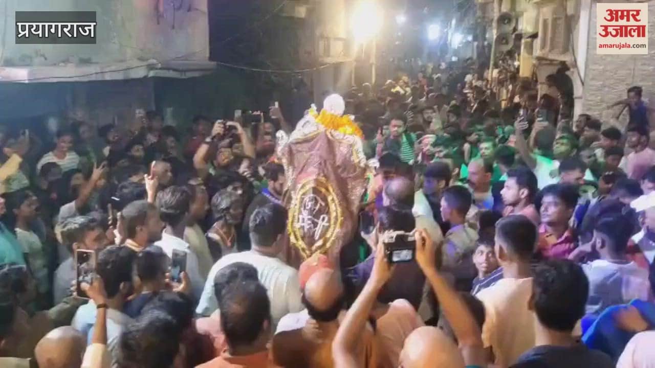 Crowds gathered in Daraganj to witness the divine play of Goddess Kali, with cheers echoing.