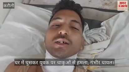 A young man was attacked with knives after entering his house, seriously injured.