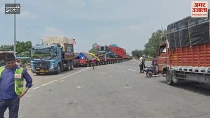 Video: You'll be dizzy counting the wheels of this truck...two drivers operate it simultaneously.